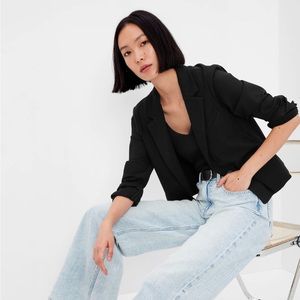 James Jeans Cropped Angle-Front Blazer with false pocket and button sleeve.